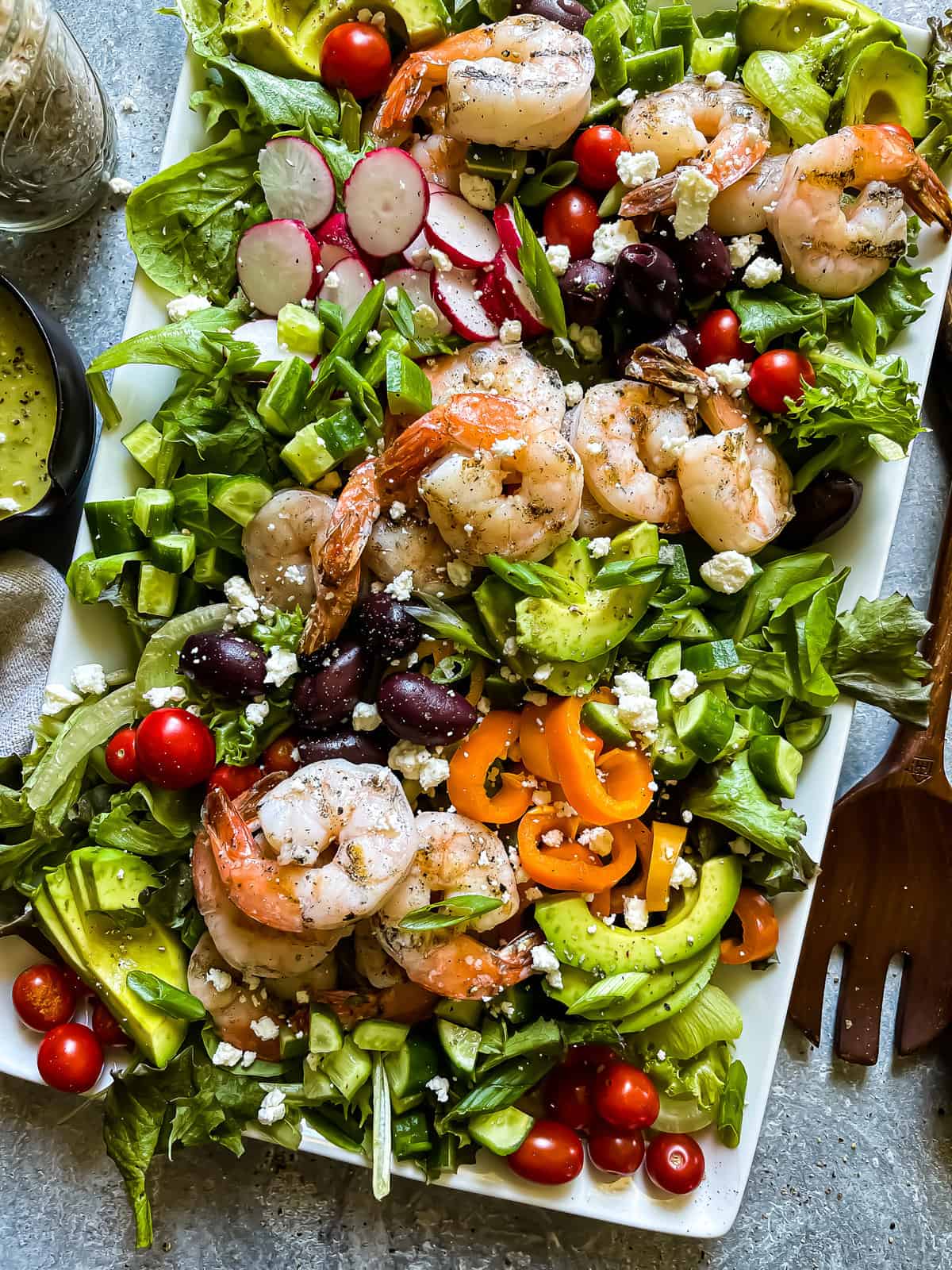 grilled shrimp salad with mixed greens, veggies, and a green onion vinaigrette