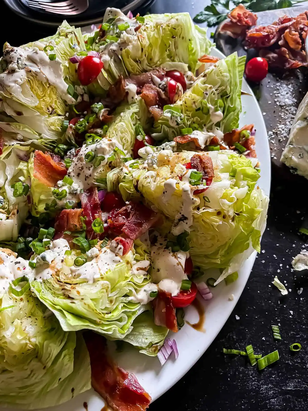 wedge salad with blue cheese, bacon, and tomatoes
