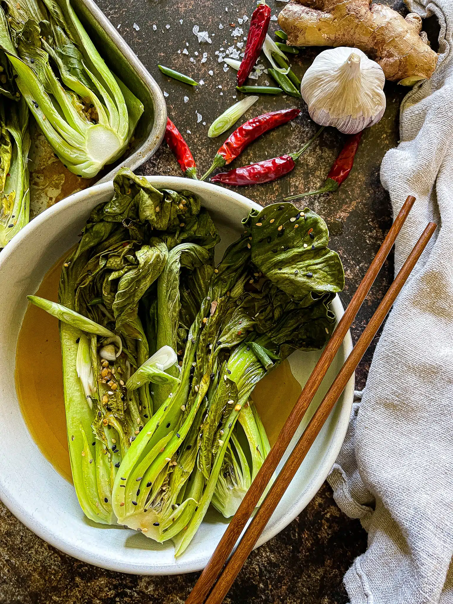 halved bok choy, roasted on a sheet pan, with a soy ginger garlic sauce